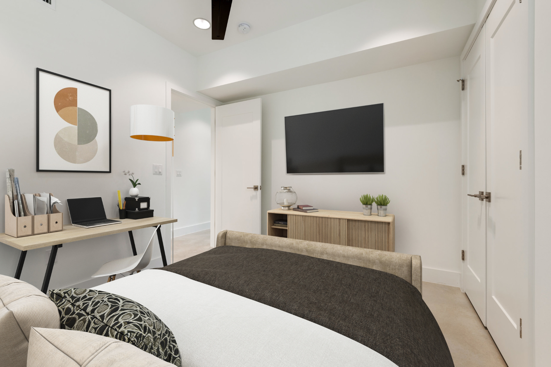 Unit 4-1 bedroom with desk and mounted TV
